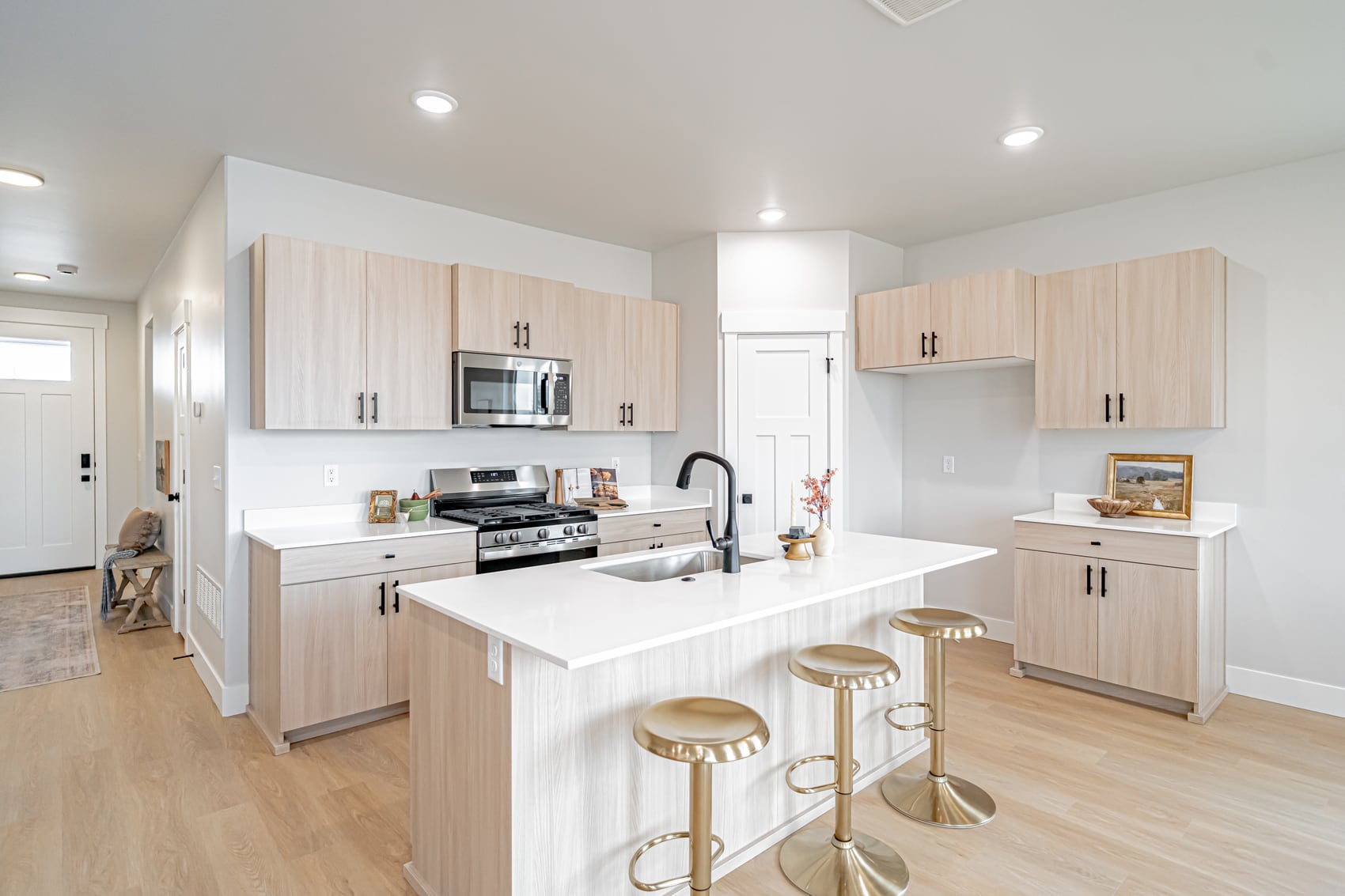 A kitchen with a sunlit island